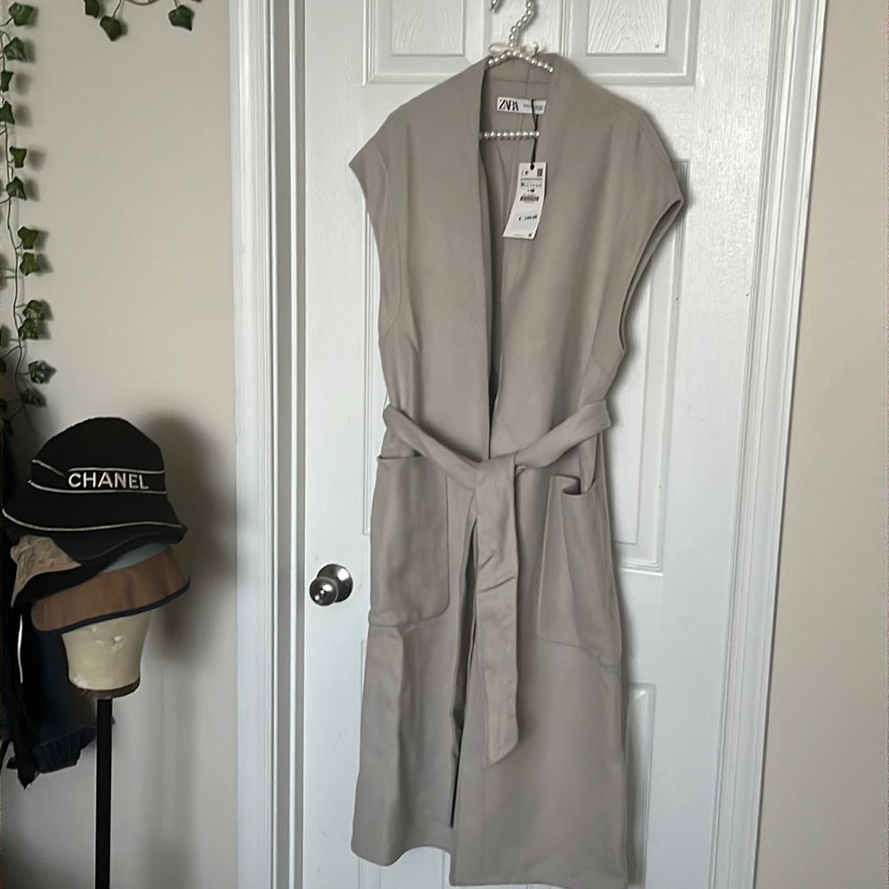 Beige layer over coat